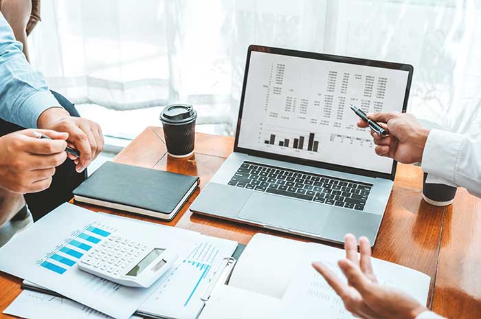 2 people at a desk working with accounting services
